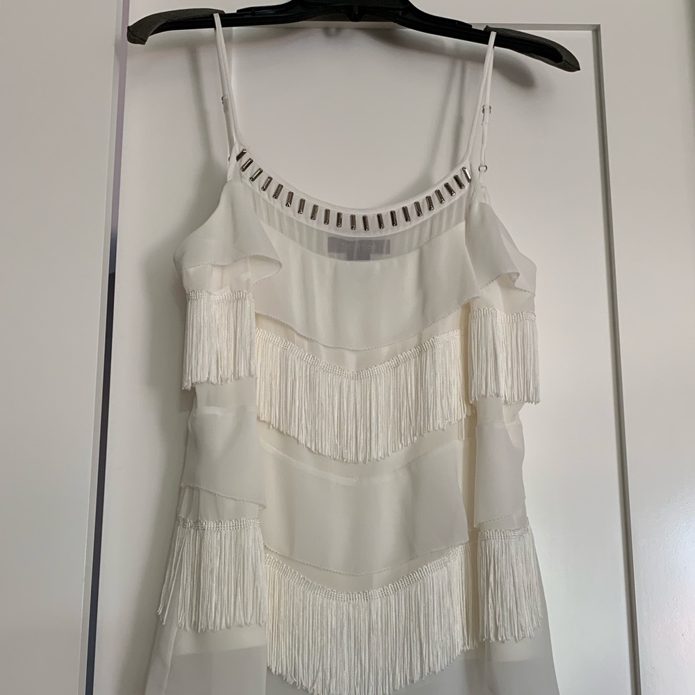 Cream blouse; fringe and silver embellishments